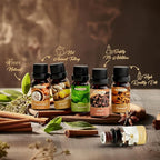 Collection of Balancing Nature essential oil bottles with spices and herbs on a wooden surface.
