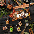 Spice collection with bottles and packaging on a wooden surface with herbs and spices.